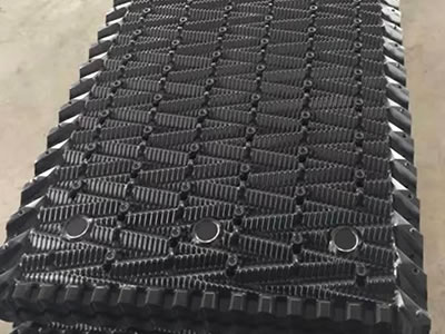 The picture shows many pieces of special cooling tower fills in black are just made in the warehouse.